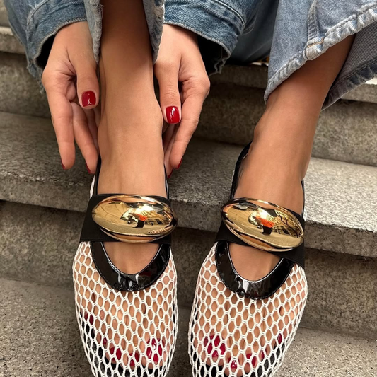 Women’s mesh loafers in white and black with gold accent. Flat, breathable summer shoes with slip-on comfort and stylish luxury detail.