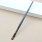 Makeup brush with an elegant design featuring a wooden handle and high-quality hairs for perfect makeup applications. Ideal for blusher, concealer, and eyeshadow.