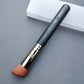 Makeup brush with an elegant design featuring a wooden handle and high-quality hairs for perfect makeup applications. Ideal for blusher, concealer, and eyeshadow.