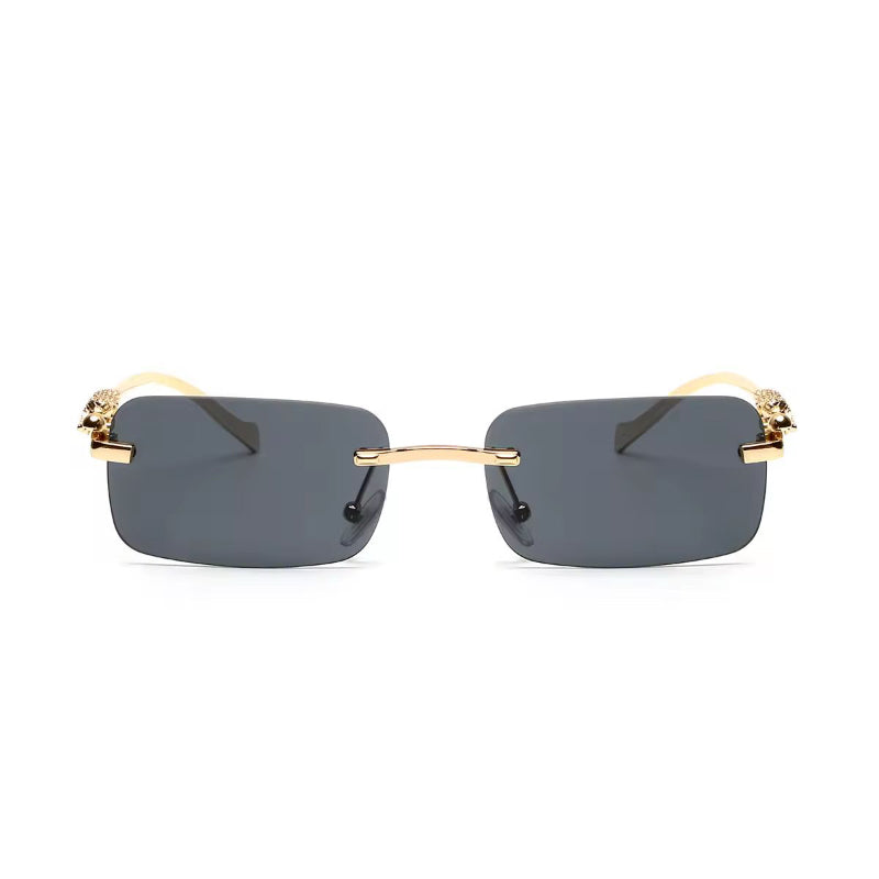 Rimless UV400 sunglasses with dark grey gradient lenses and gold panther detail
