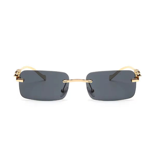 Rimless UV400 sunglasses with dark grey gradient lenses and gold panther detail
