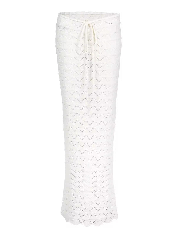 Two-piece Sahara Boho crochet outfit for women in white and brown, featuring an off-shoulder long sleeve crop top and high-waisted maxi skirt with drawstring, perfect for beachwear, festivals, and summer vacations