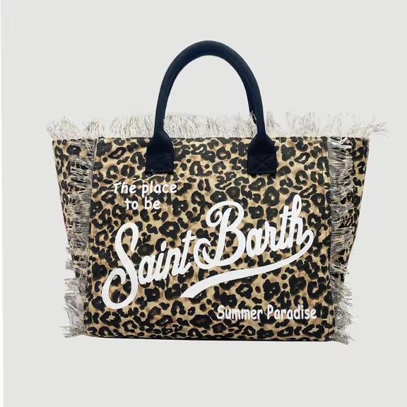 Saint Barth beach bags in hot pink, leopard print, ivory and natural straw – colorful canvas totes with boho vibe for summer 2025.