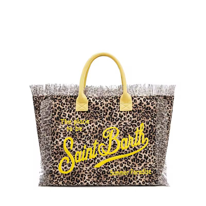 Extra-large Saint Barth canvas beach bag for women with boho fringe and summer script, oversized and handcrafted look.
