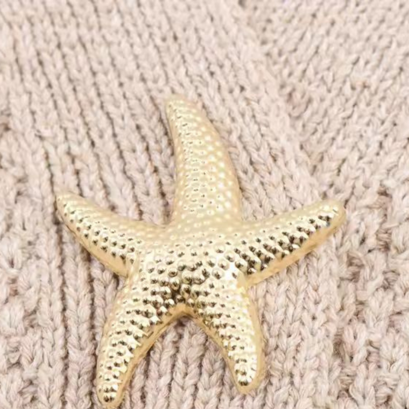 Gold-tone starfish button detail on the Sea Star Cardigan – women’s summer knitwear