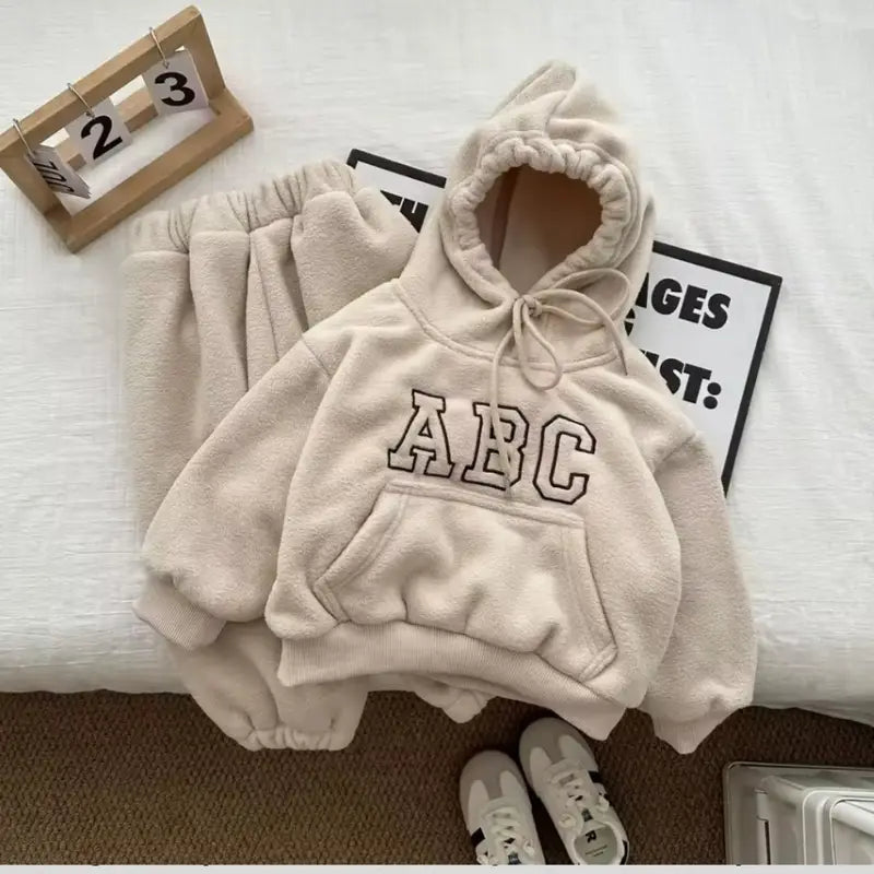 Cozy set of plush hoodie and jogging pants made from 100% polyester, featuring drawstring, kangaroo pocket, and elastic waistband for a comfortable fit, perfect for casual lifestyle or relaxation.