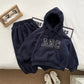 Cozy set of plush hoodie and jogging pants made from 100% polyester, featuring drawstring, kangaroo pocket, and elastic waistband for a comfortable fit, perfect for casual lifestyle or relaxation.