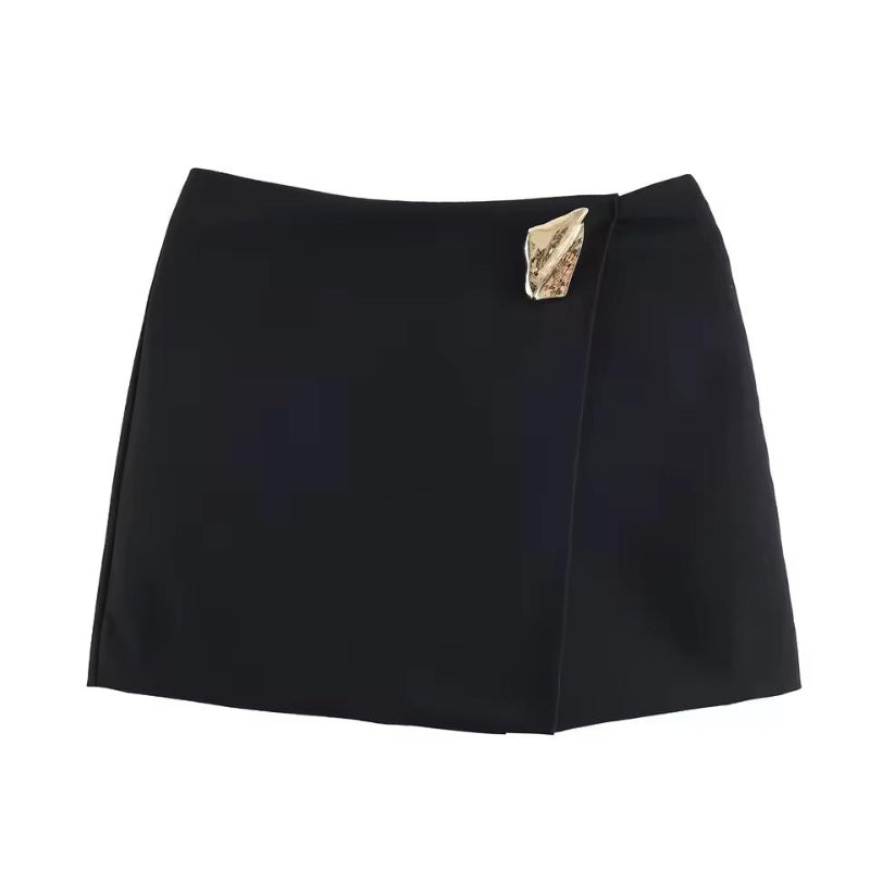 Black high-waist wrap mini skirt with metallic accent – minimalist autumn fashion.
