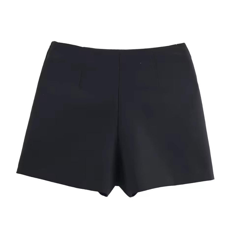 Black high-waist wrap mini skirt with metallic accent – minimalist autumn fashion.
