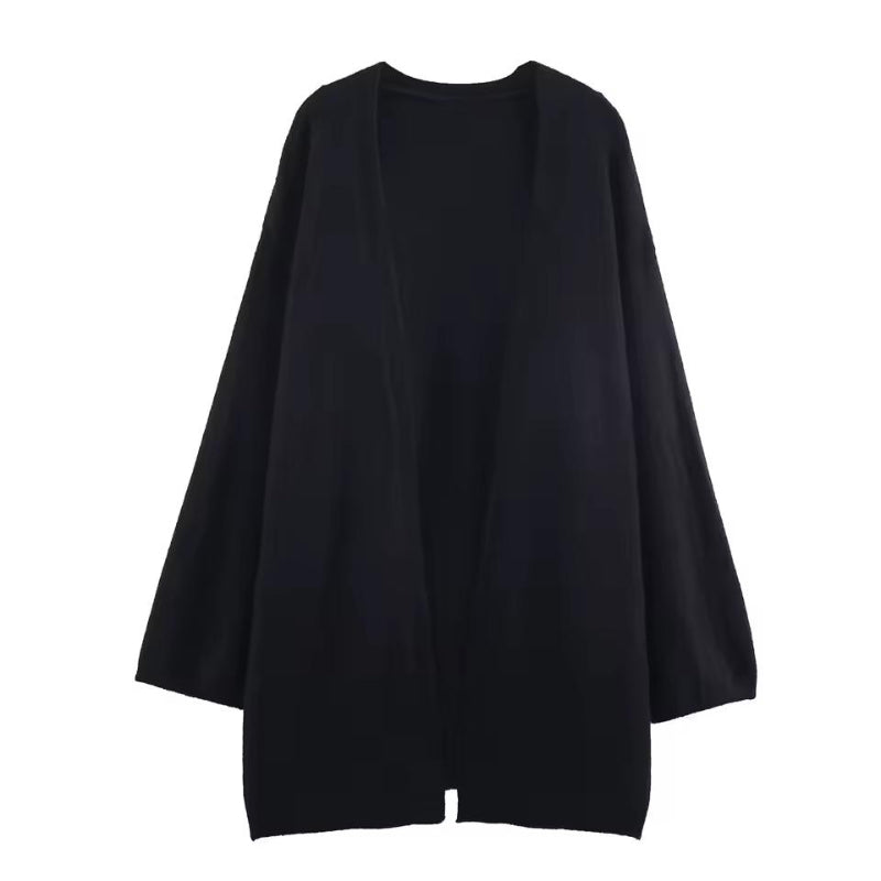 Soft knit cardigan with delicate texture and button detail – luxury women’s knitwear in neutral tones.
