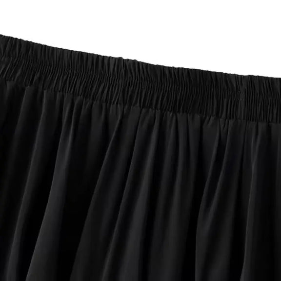 Elegant short tulle skirt with silk-like shorts, A-line fit, elastic waistband, and delicate pleats for a feminine, stylish look. Perfect for parties and special occasions