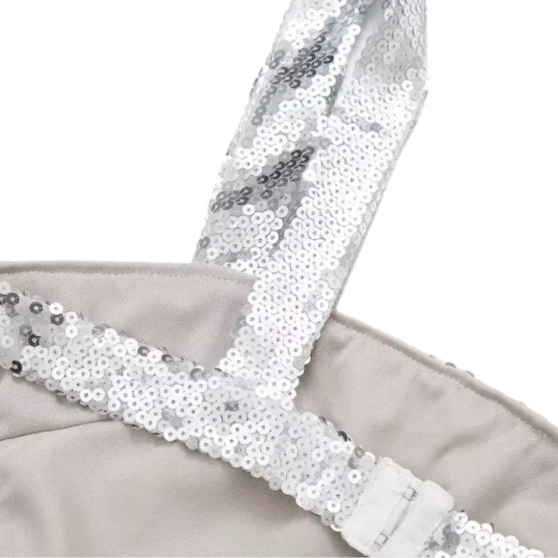 Model wearing the Silver Gleam Sequin Dress with thin straps and a figure-hugging silhouette, perfect for festive events