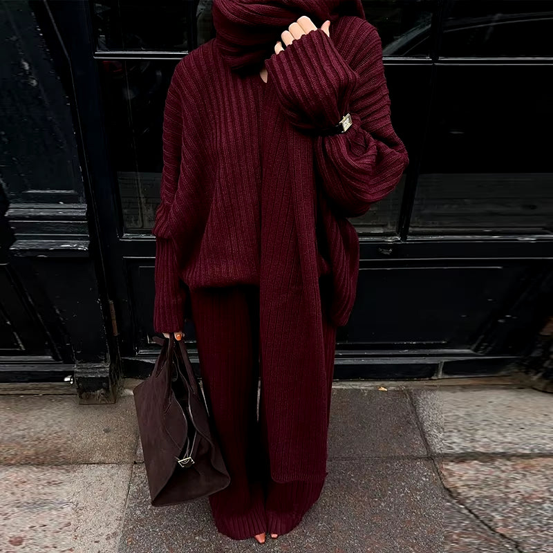 Stylish women's outfit: Oversized knitted set with V-neck pullover and comfortable wide-cut pants.