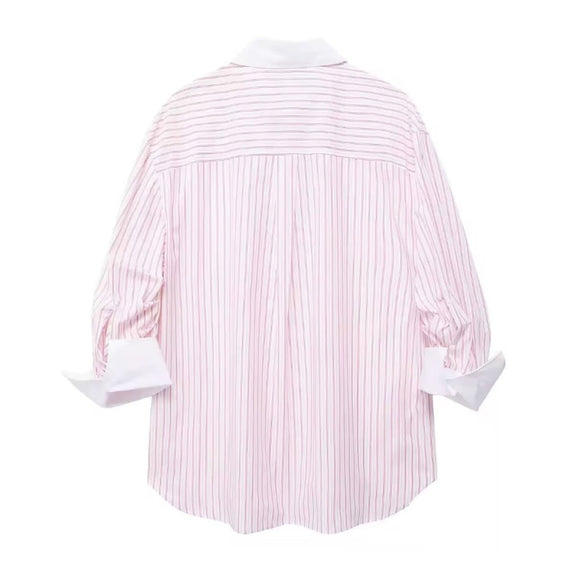 Oversized women’s pink striped button‑down shirt – long sleeves, white contrast collar and cuffs, chest pocket, lightweight poplin fabric, casual summer style.
