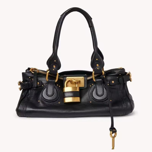 Black structured PU leather handbag with gold padlock and dual handles – The CHARM LOCK Bag by Chic & Charm.
