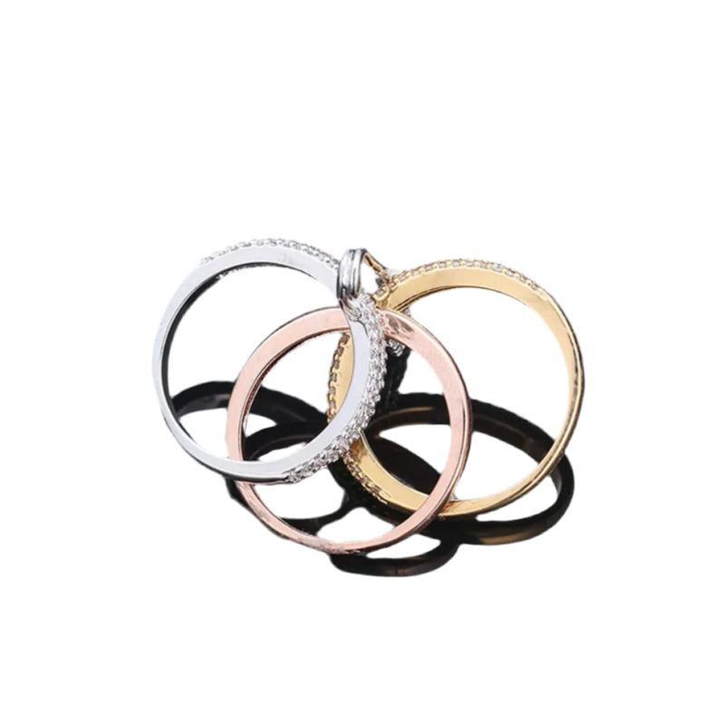 Gold triple zirconia ring with safety pin design.