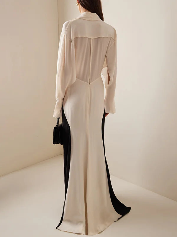 Long black and cream evening dress with concealed zipper and elegant back drape design
