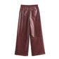 High-quality vegan leather trousers in burgundy red, perfect for casual and formal wear.