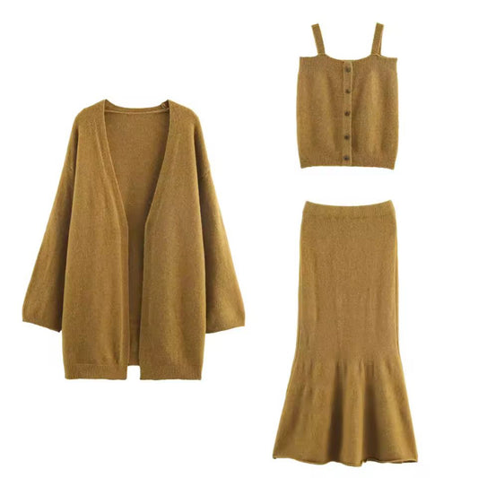Elegant women’s 3-piece knit set with cardigan, strap top and trumpet skirt in soft fine knit fabric – autumn winter premium knitwear outfit, minimalist style.
