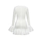 White short dress with ruffles at the hem and sleeves, ideal for summer parties and evening events.