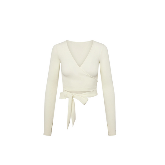 Minimalist women’s sculpted wrap top – ribbed texture, feminine fit, neutral tones – everyday luxury outfit.