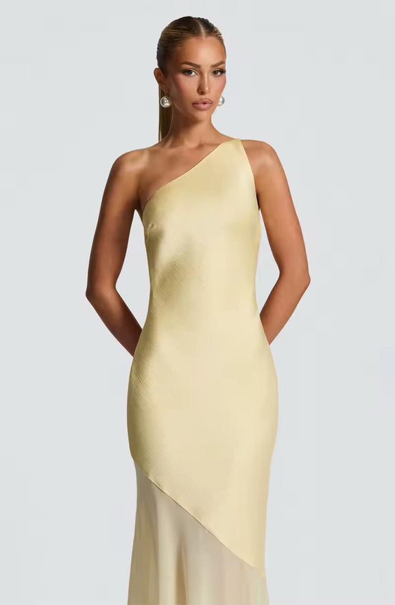 Elegant yellow evening gown with tie-back detail and sheer hem – perfect for weddings and summer parties
