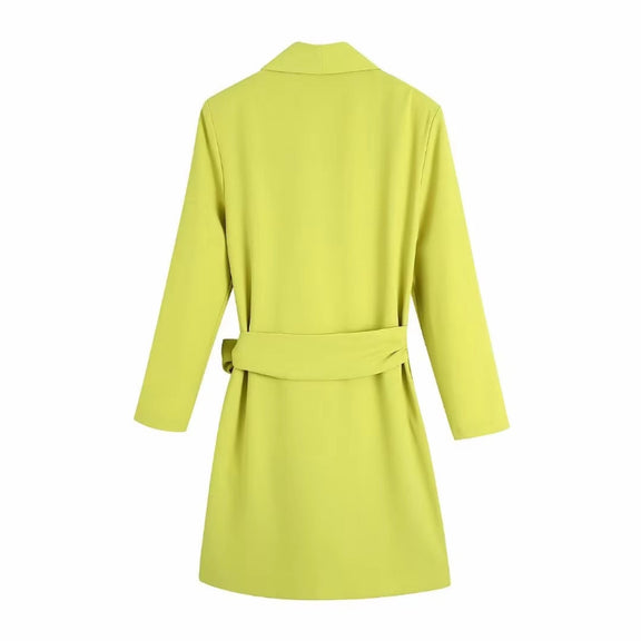 Bright yellow polyester wrap dress with tie waist, perfect for summer days or evening outings.
