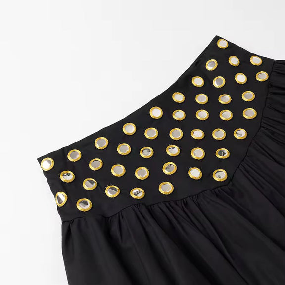 Full-body view of black ruffle crop top with pleated skirt from ZAYA set – sleek & sexy silhouette
