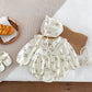 FloralDream baby set with floral romper, hat, handbag, and sandals made from soft cotton and polyester, perfect for stylish and comfortable baby wear.